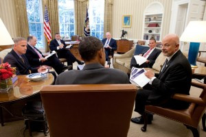 Director of National Intelligence James Clapper (right) talks with President Barack Obama in the Oval Office, with John Brennan and other national security aides present. (Photo credit: Office of Director of National Intelligence)