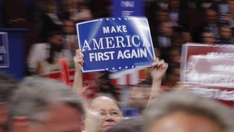 A delegate waves a "Make America First Again" sign on the floor during the Republican National Convention in Cleveland, Ohio, US [Brian Snyder/Reuters]