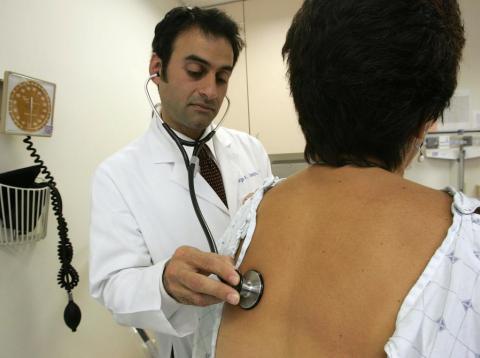 Dr. George Sawaya examines a person at the UCSF Women's Health Center in June 2006.