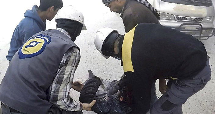 This photo provided by the Syrian Civil Defense White Helmets, which has been authenticated based on its contents and other AP reporting, shows members of the Syrian Civil Defense group helping a wounded man after airstrikes hit Ghouta, a suburb of Damascus, Syria, Thursday, March. 1, 2018
