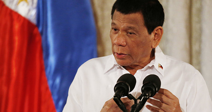 Philippine President Rodrigo Duterte addresses congressmen and government officials