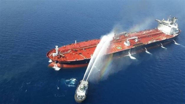 The picture, taken by Tasnim news agency on June 13, 2019, shows an Iranian Navy boat trying to control fire from Norwegian-owned Front Altair tanker in the waters of the Gulf of Oman. (Via AFP)